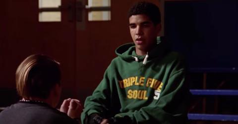 Drake plays Jimmy on 'Degrassi', sitting in wheelchair wearing a green sweatshirt