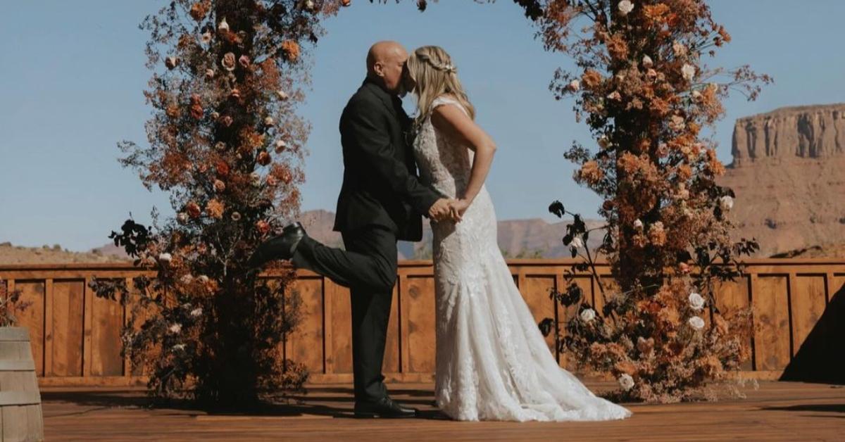 (l-r): David Woolley and Christine Brown kissing on their wedding day