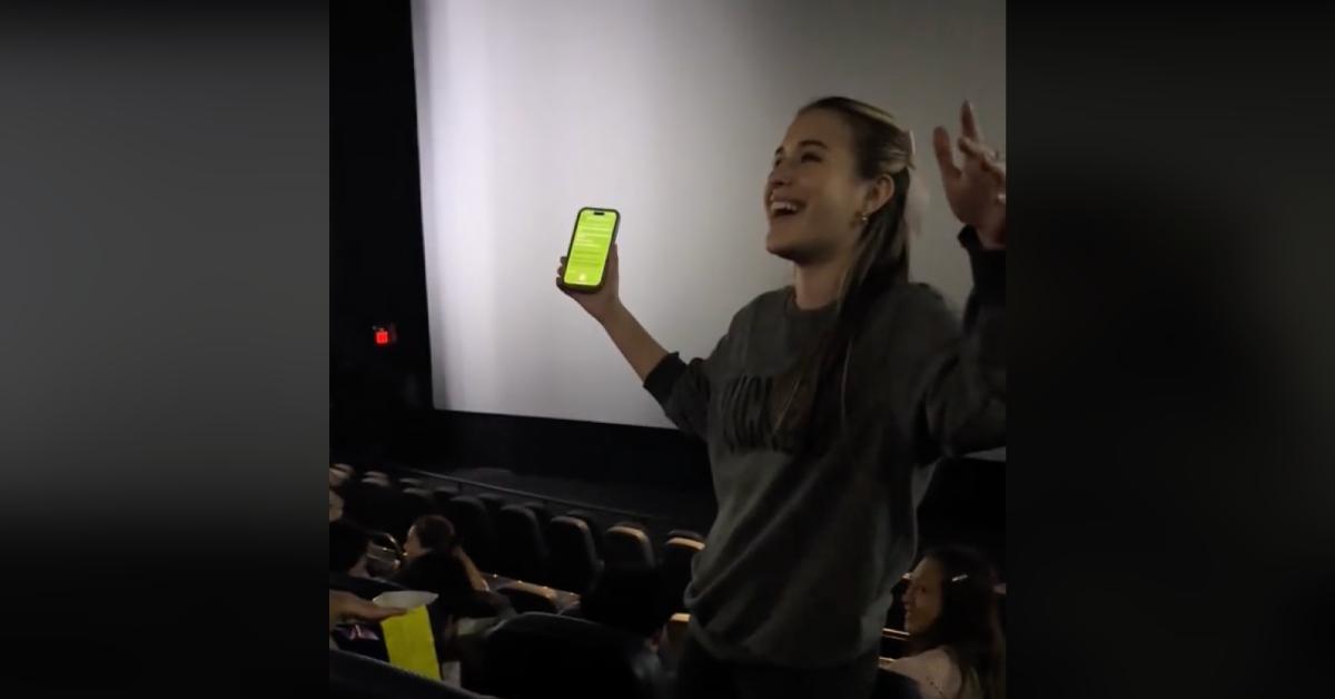 Woman singing in the movie theater before 'Wicked' started playing.