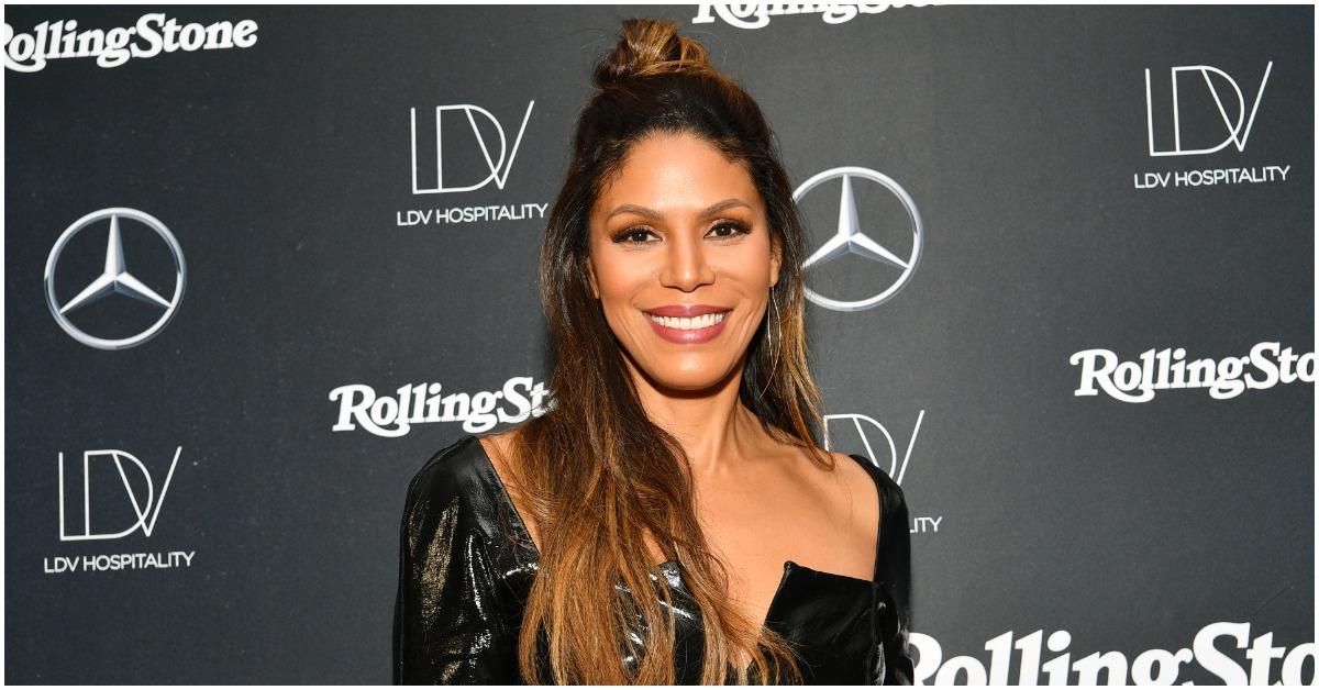 Merle Dandridge smiling on the red carpet at an event.