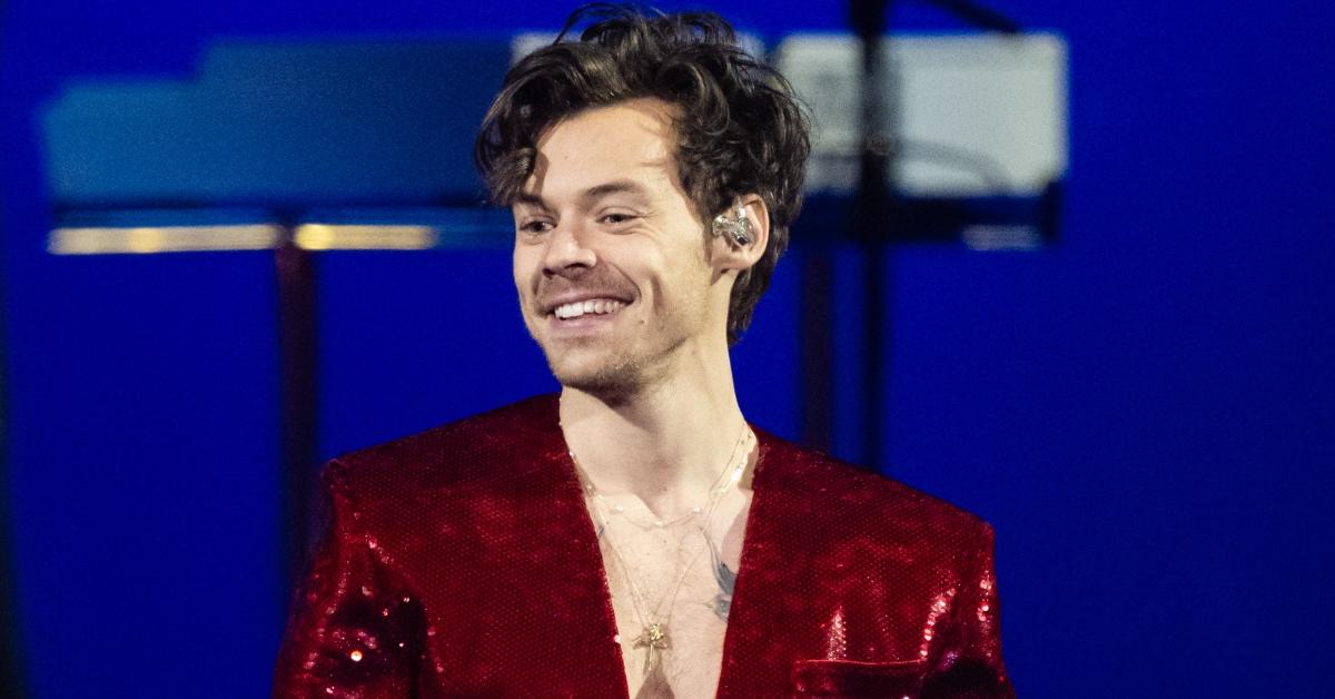 Harry Styles performs live on stage during The BRIT Awards 2023.