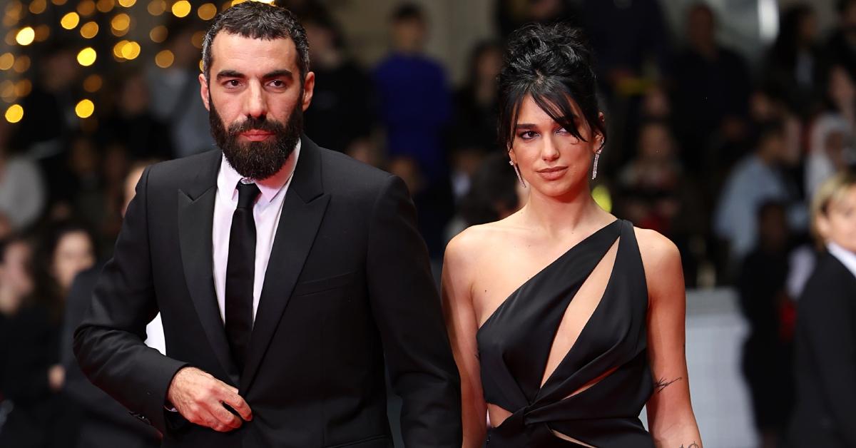 Romain Gavras and Dua Lipa attend the "Omar La Fraise (The King of Algiers)" red carpet during the 76th annual Cannes film festival.