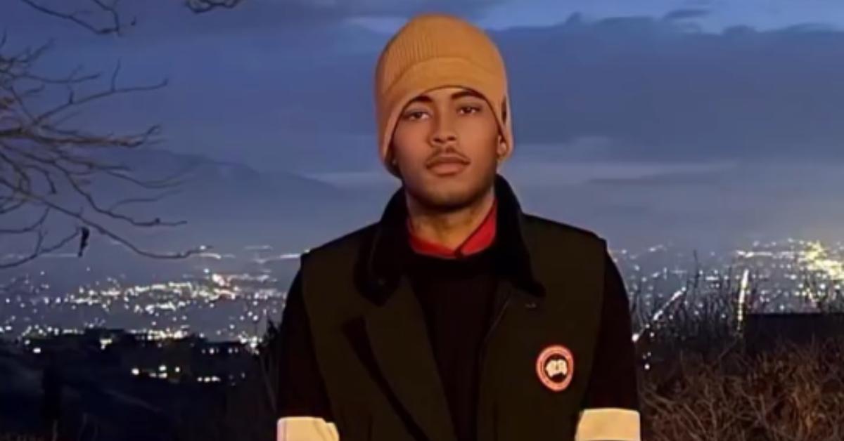 Robert Cosby Jr. stands on a balcony overlooking Salt Lake City.