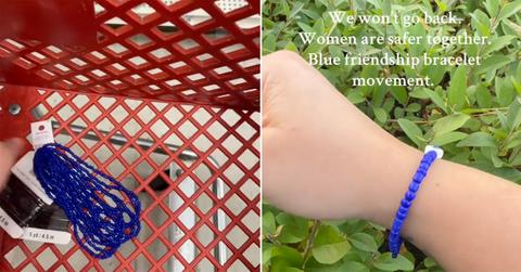 A bunch of blue bracelets and one on a wrist.