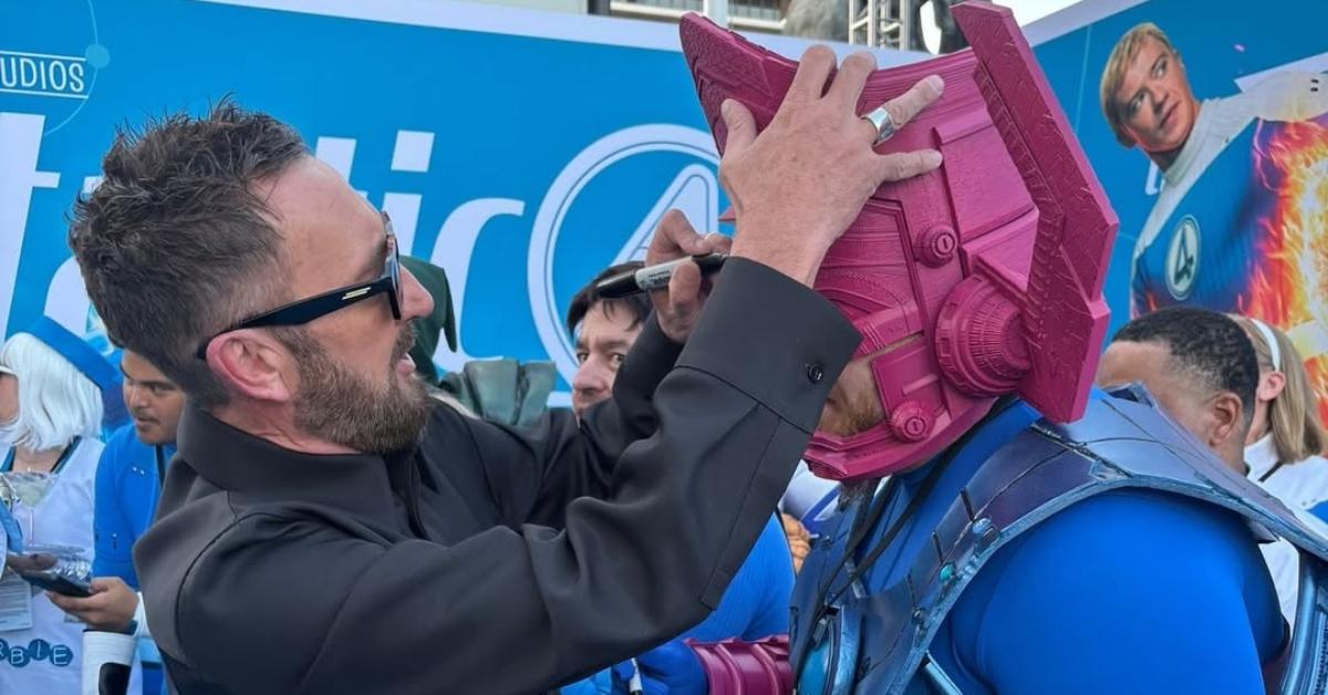 Ralph Ineson signing a fan's Galactus helmet.