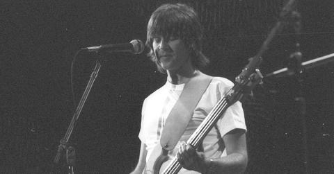 Randy Meisner playing bass in black and white for The Eagles.