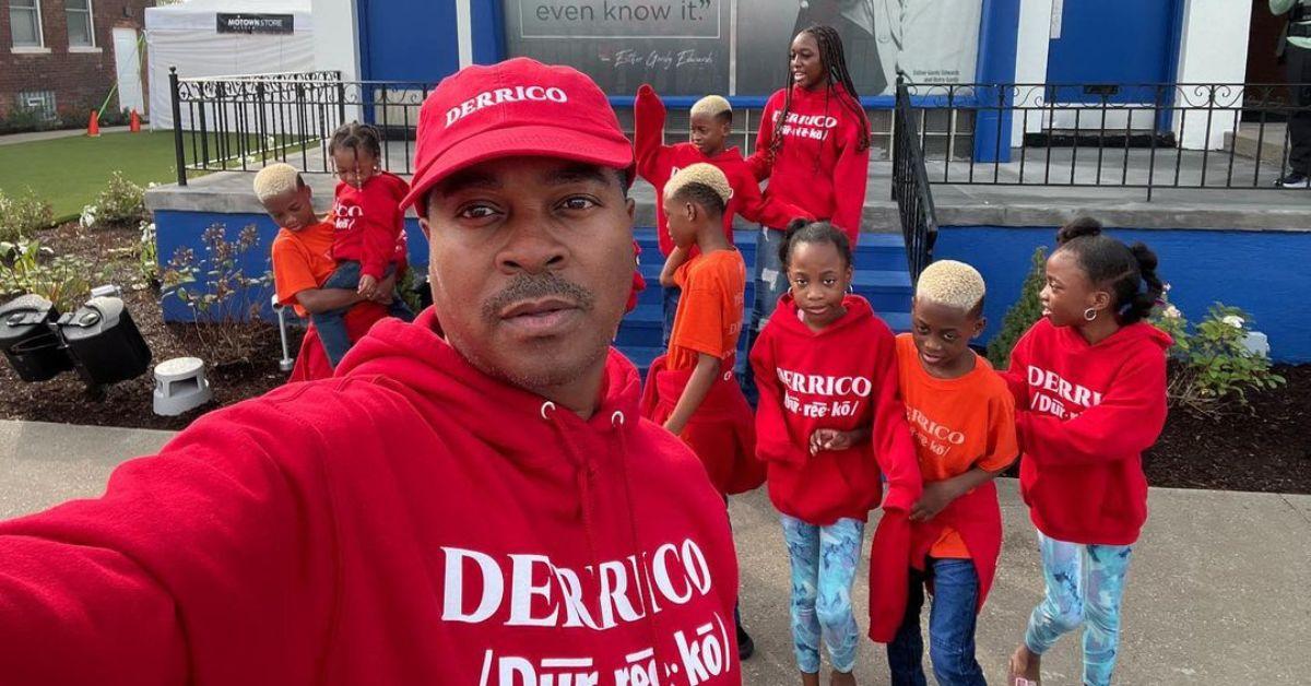 Deon Derrico and his children wearing red hoodies