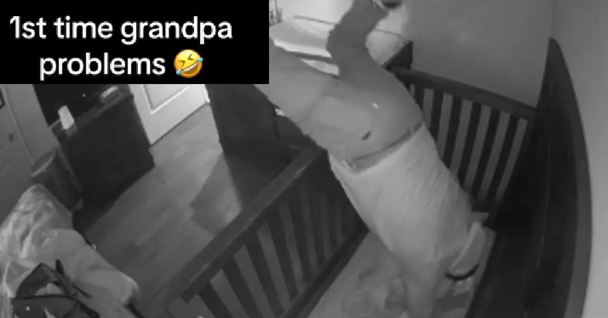 Viral still of video of grandpa falling into baby crib.