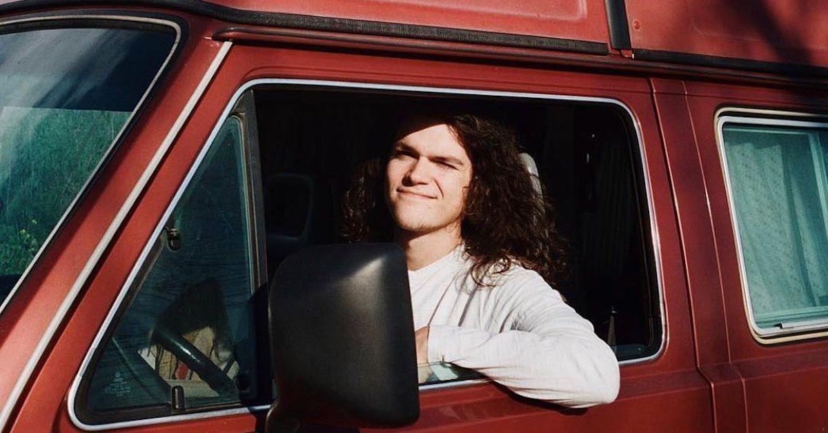 Jacob Roloff driving his red van.