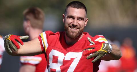 Travis Kelce in uniform on the field.