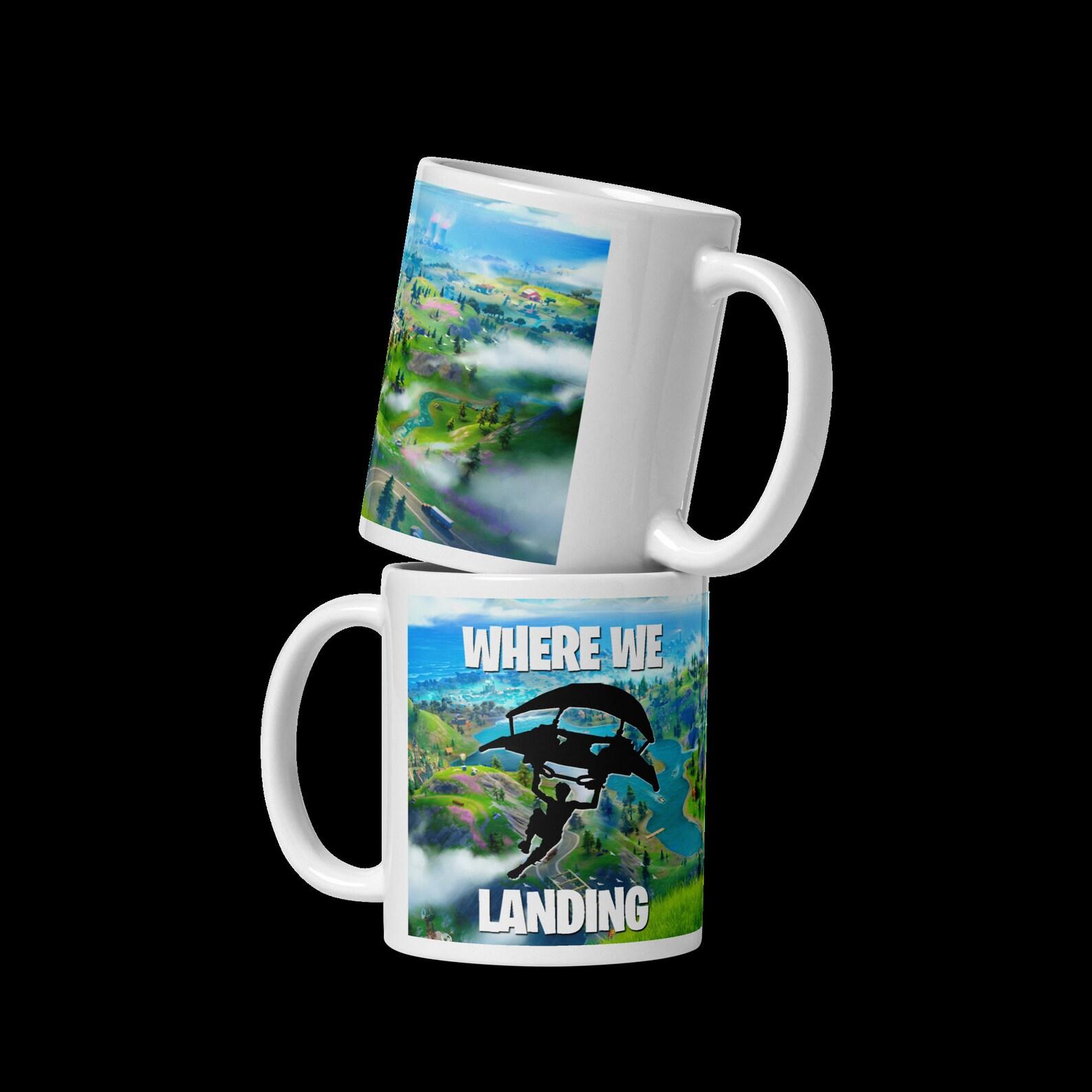 A mug that says "where we landing"