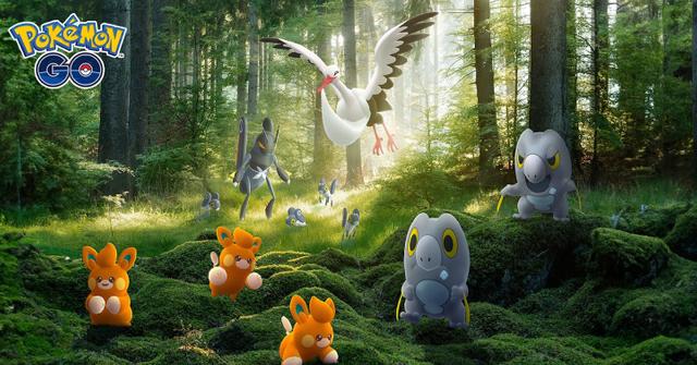 'Pokémon GO' Several creatures standing inside a sunlit forest.