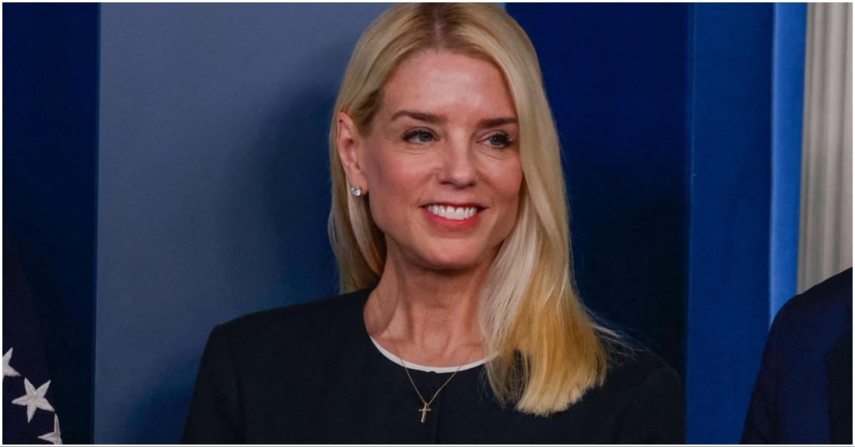 Pam Bondi smiling while attending a conference