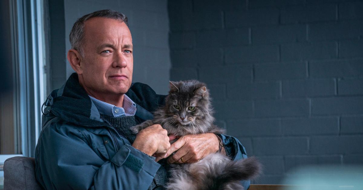 Otto (Tom Hanks) holding a cat in 'A Man Called Otto'