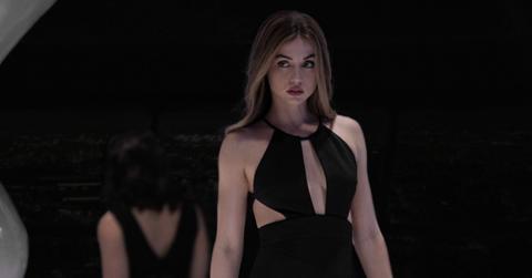 Ana de Armas as Sadie in Apple TV+'s 'Ghosted', wearing a black cutout dress.