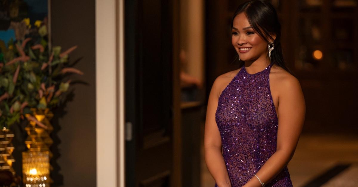 Jenn Tran greets her guys in a purple sparkly dress on the Bachelorette