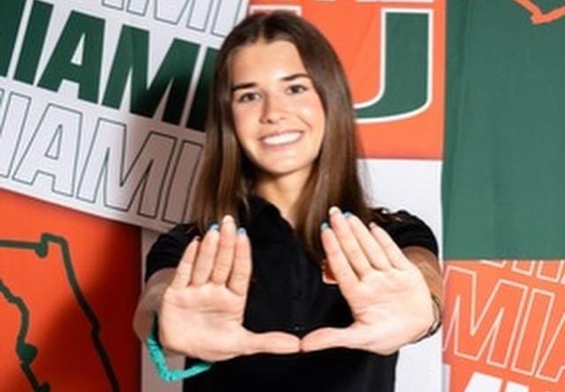 Kai Trump holding her hands up in the U for University of Miami