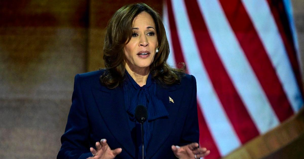 Kamala Harris addresses the crowd in a navy suit at the 2024 DNC Convention in Milwaukee