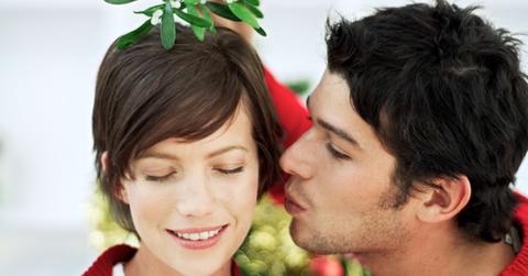 Why Do We Kiss Under The Mistletoe? All About The Tradition