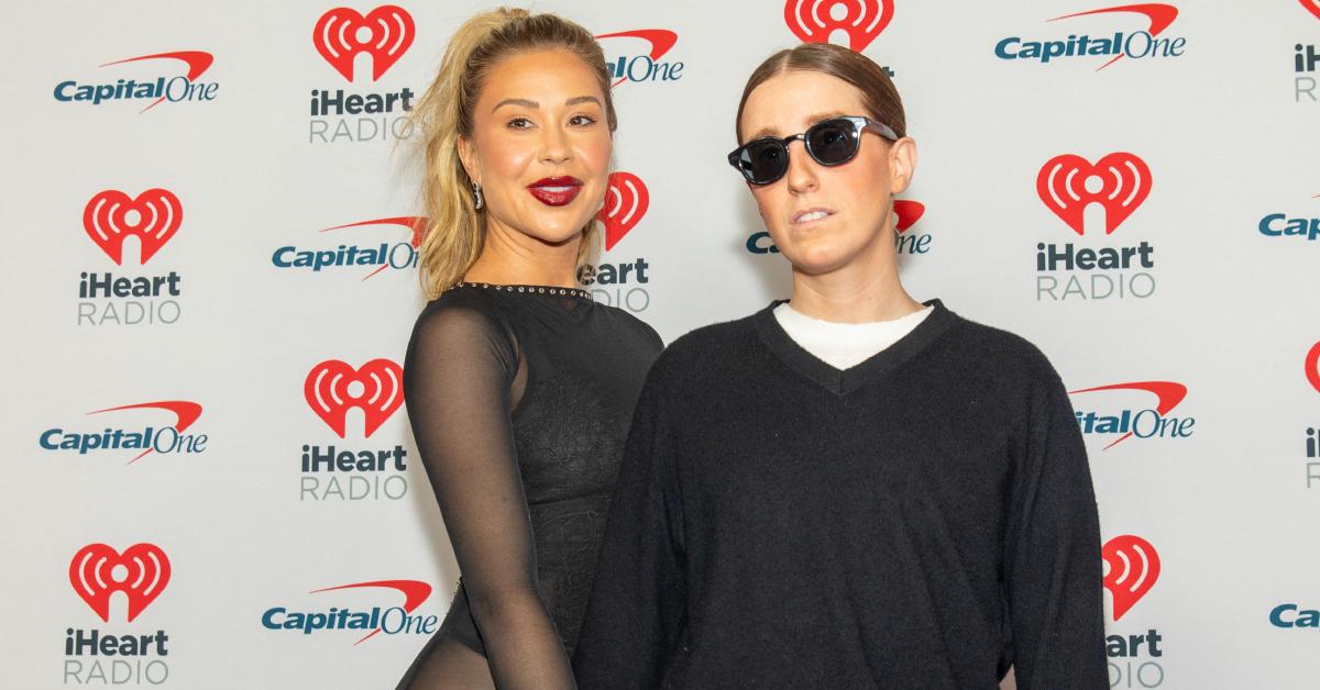 Gabby Windey and her girlfriend, Robby Hoffman, pose on a red carpet together.