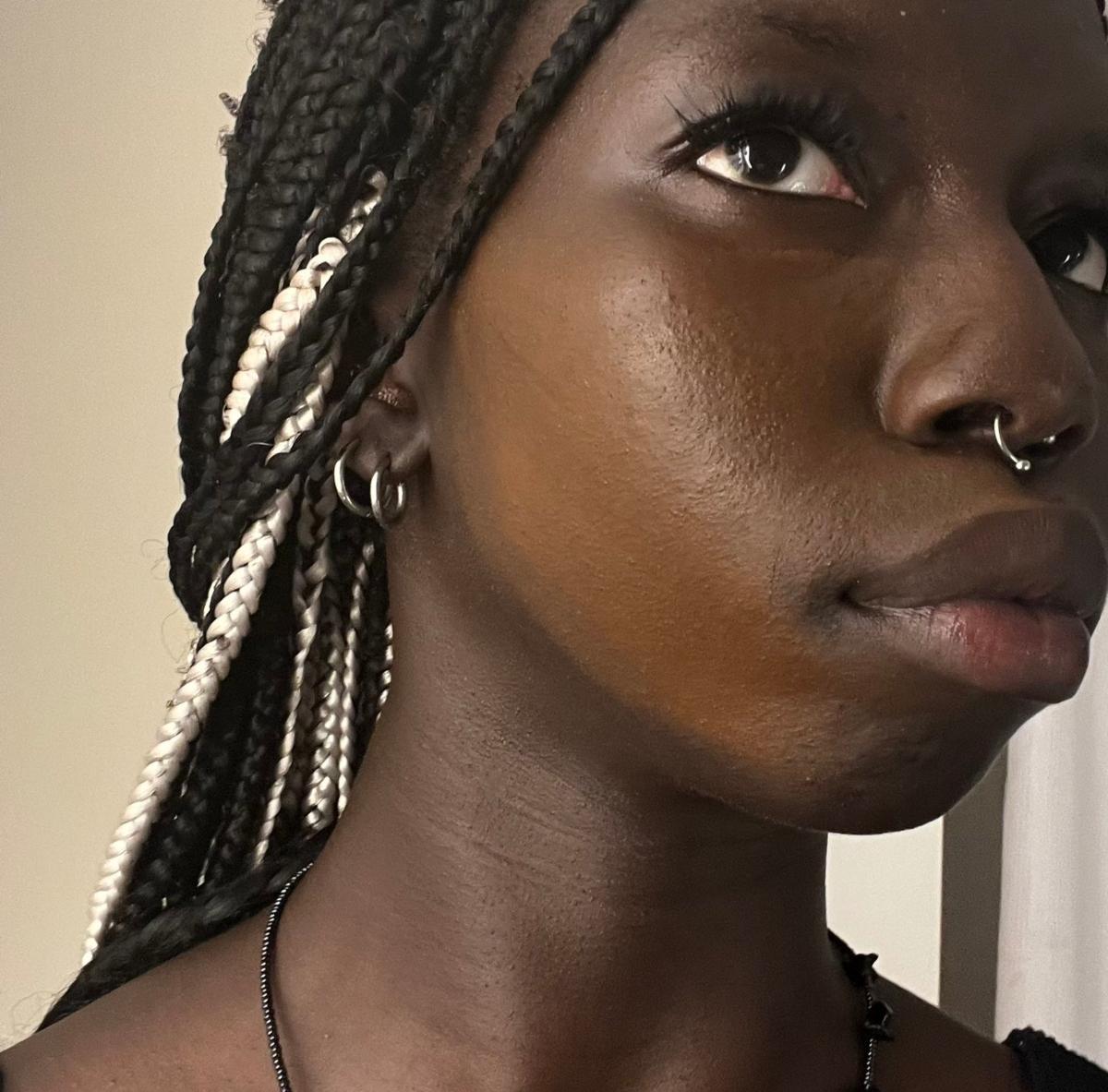 Sarah Lugor showing how the brand's darkest shade looks on her skin now