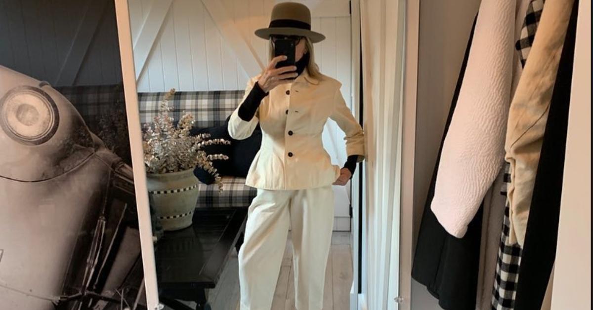 Diane Keaton takes a mirror selfie in her signature hat and turtleneck.