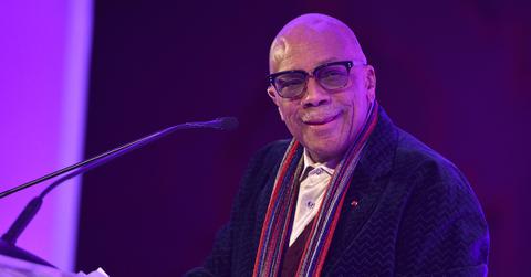 Quincy Jones standing at a podium.