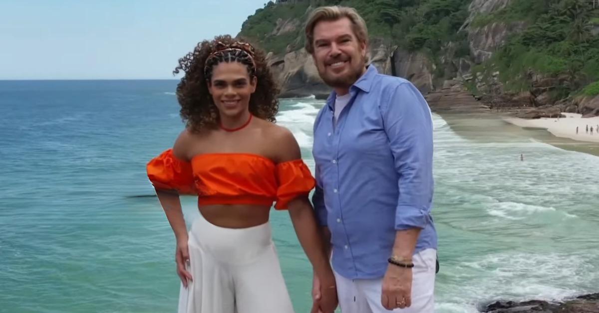 Alliya Batista and Shawn Finch smile while posing in front of the ocean in '90 Day Fiancé: Love in Paradise' Season 4.