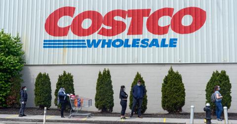 People wait in line at a Costco during the COVID-19 pandemic.