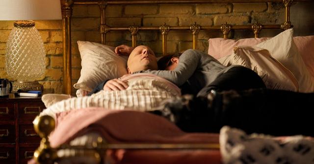 James Roday Rodriguez as Gary dying in bed and Allison Miller as Maggie crying next to him with their dog, Colin.