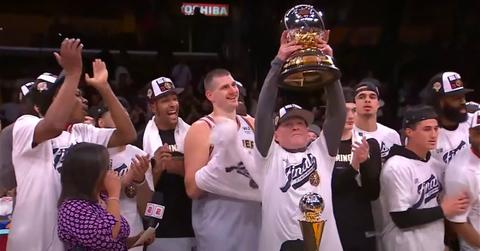 The Denver Nuggets receive the Oscar Robertson Trophy as the 2023 NBA Western Conference Champions.