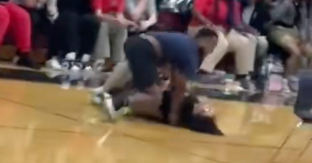 Teacher body slams a student during musical chairs.