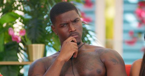 Demari looks confused while sitting at the cabana in Season 6 of ‘Too Hot to Handle.’