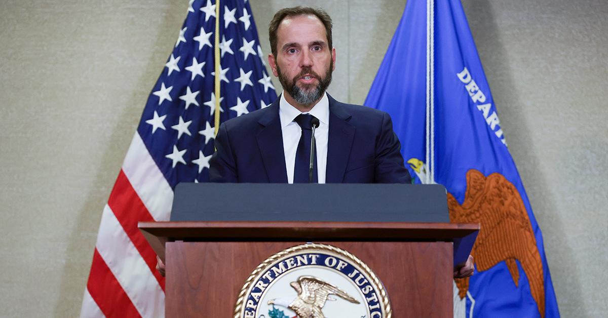 Jack Smith speaking at a podium announcing the indictment of Donald Trump. 