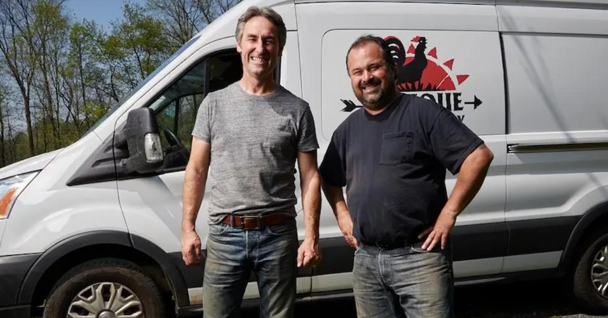 Mike Wolfe and Frank Fritz standing in front of a white van