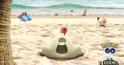 Sandygast and some Water-type Pokémon on a beach in 'Pokémon GO'
