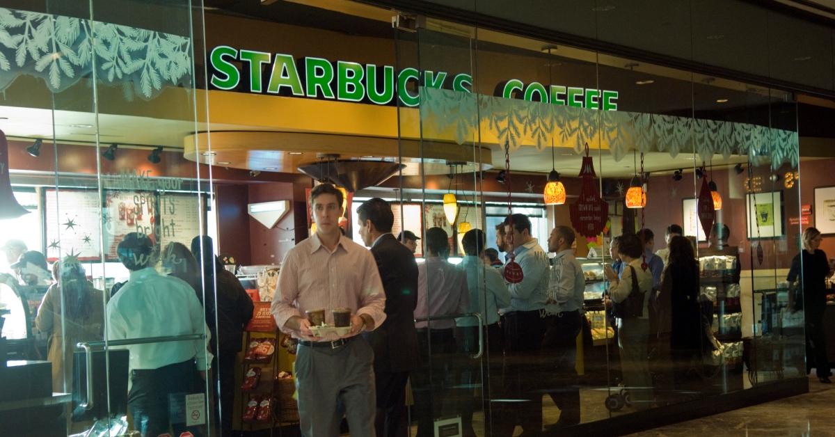 Starbucks workers and guests at a location.