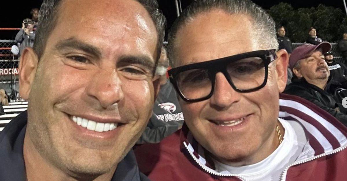 Luis Ruelas and James Leonard take a selfie at a high school football game