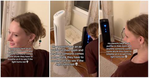 Young girl wearing a t-shirt kneels on the floor to take breathalyzer test with air purifier.