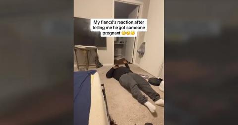 The man continues his meltdown on the bedroom floor