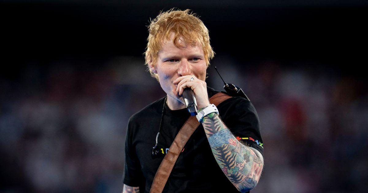 Ed Sheeran singing at a concert in Madrid.