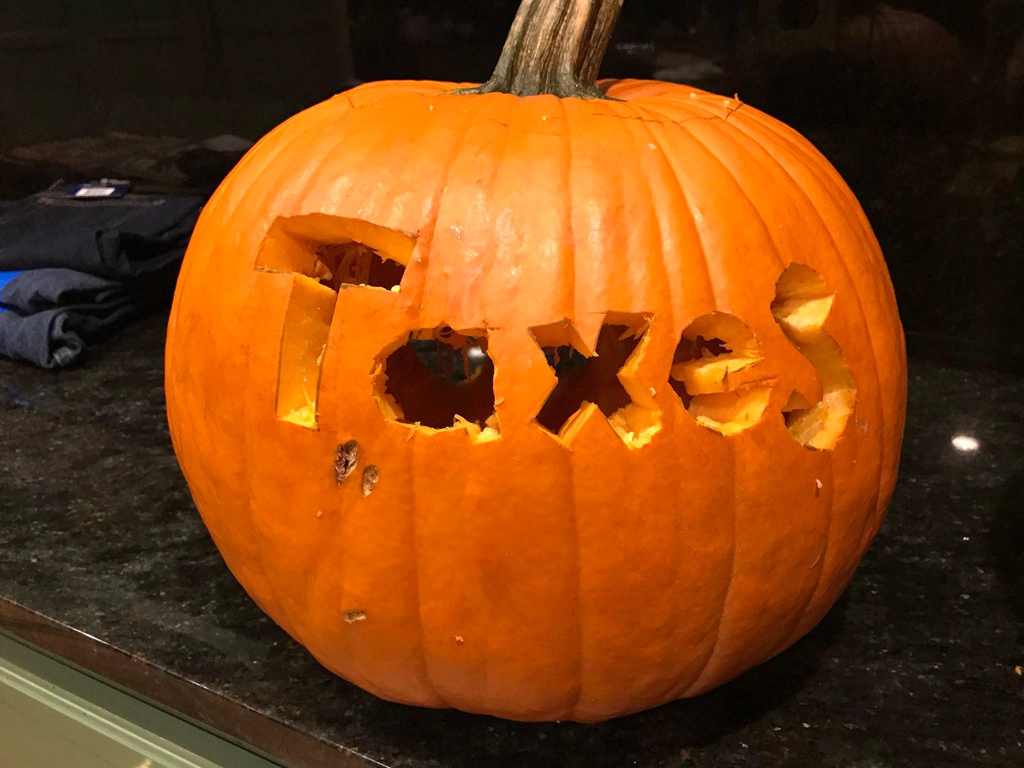 a-carved-pumpkin-with-large-eyes-and-teeth