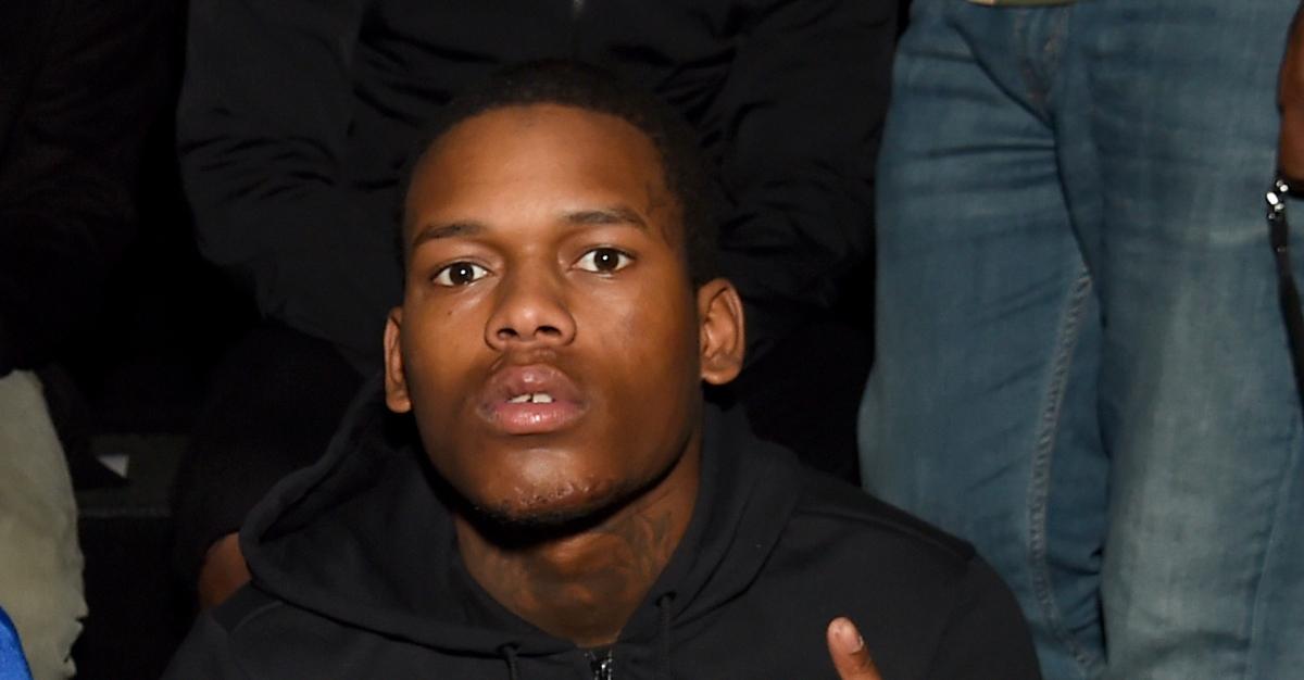 Chicago rapper Lud Foe at Rochambeau fashion show during New York Fashion Week 2020 in black hoodie.