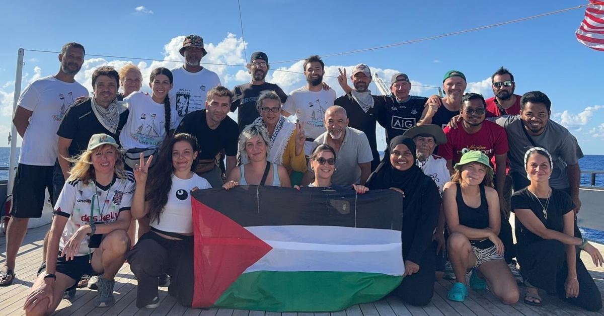 Greta Thunberg and other aid flotilla workers pose on the ALMA while attempting to bring aid to Palestine