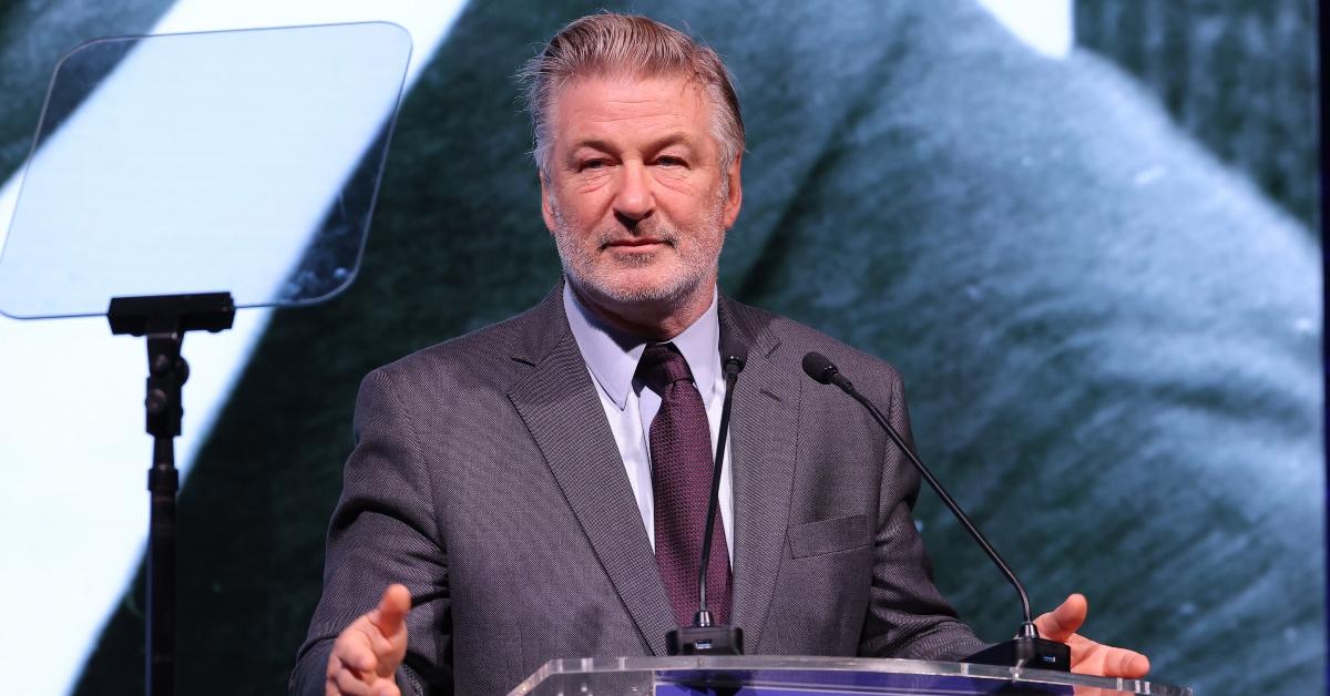 Actor Alec Baldwin presents at an awards show looking tired. 