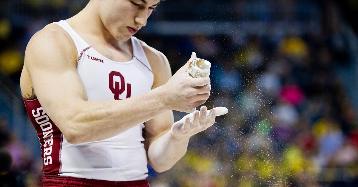 A male gymnast uses honey at the NCAA Men's Gymnastics Championships in 2014