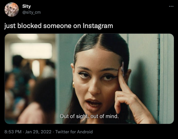 A tweet that reads "just blocked someone on Instagram" with a photo reading "Out of sight, out of mind."