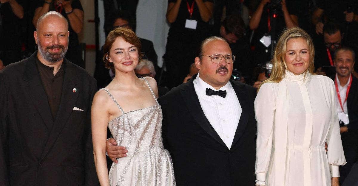 Emma Stone and Stavros Halkias on the red carpet for Bugonia