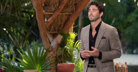 'The Bachelor' Season 28 lead Joey Graziadei wears a black dress shirt and brown suit during a rose ceremony.