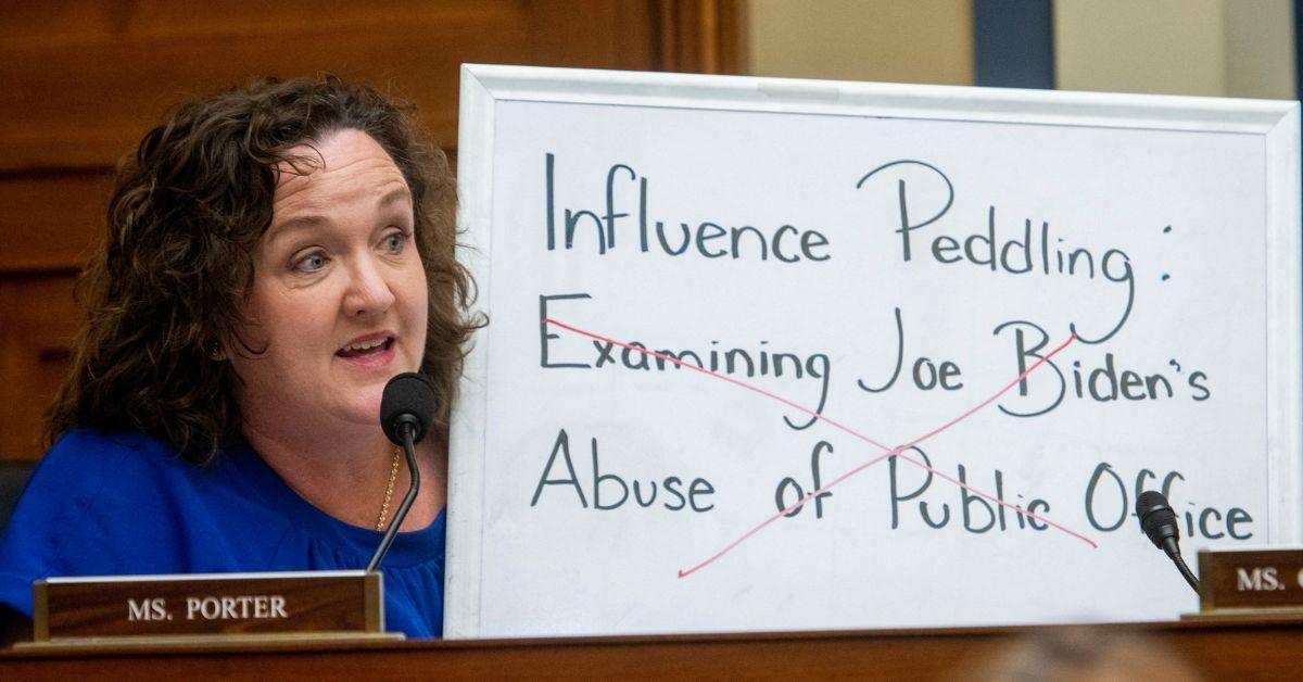Katie Porter at a Congressional hearing with a white board in 2024.